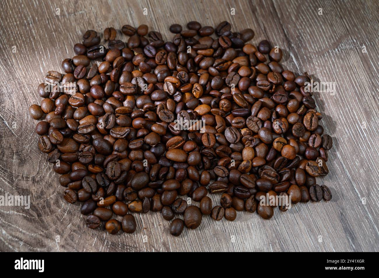 Roasted coffee beans on a flat background Stock Photo - Alamy