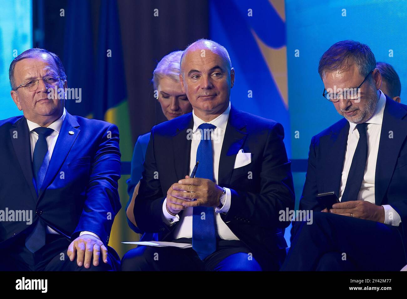 Bucharest, Romania. 15th Sep, 2024: Rares Bogdan (C), PNL First Vice-President Communication and International Relations and MEP, and PNL vice-presidents Gheorghe Flutur (L) and MEP Dan Motreanu (R) attend the National Council of National Liberal Party (PNL), held at the Palace of the Romanian Parliament. The council met to validate the president of the party, Nicolae Ciuca, as the candidate of the PNL for the Presidency of Romania. Credit: Lucian Alecu/Alamy Live News Stock Photo