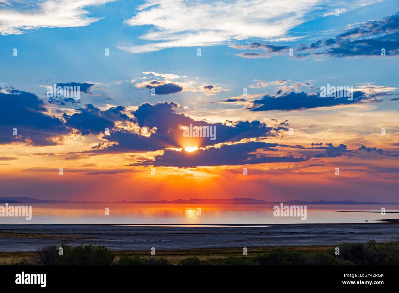 The sun sets over the Great Salt Lake as seen  from Bridger Bay, Antelope Island State Park, Davis County, Utah, USA. Stock Photo