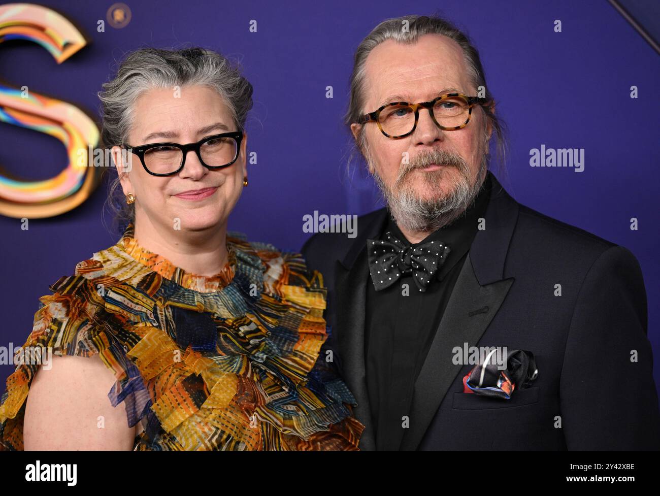 Los Angeles, United States. 15th Sep, 2024. (L-R) Gisele Schmidt and Gary  Oldman arrive for the 76th annual Primetime Emmy Awards at the Peacock  Theater in Los Angeles on Sunday, September 15,