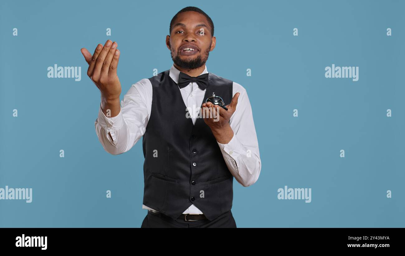 Hotel worker welcoming guests hi-res stock photography and images - Alamy