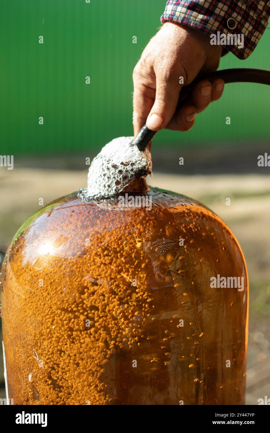 Large water bottle. Liquid canister. Large size plastic bootlock. Stock Photo