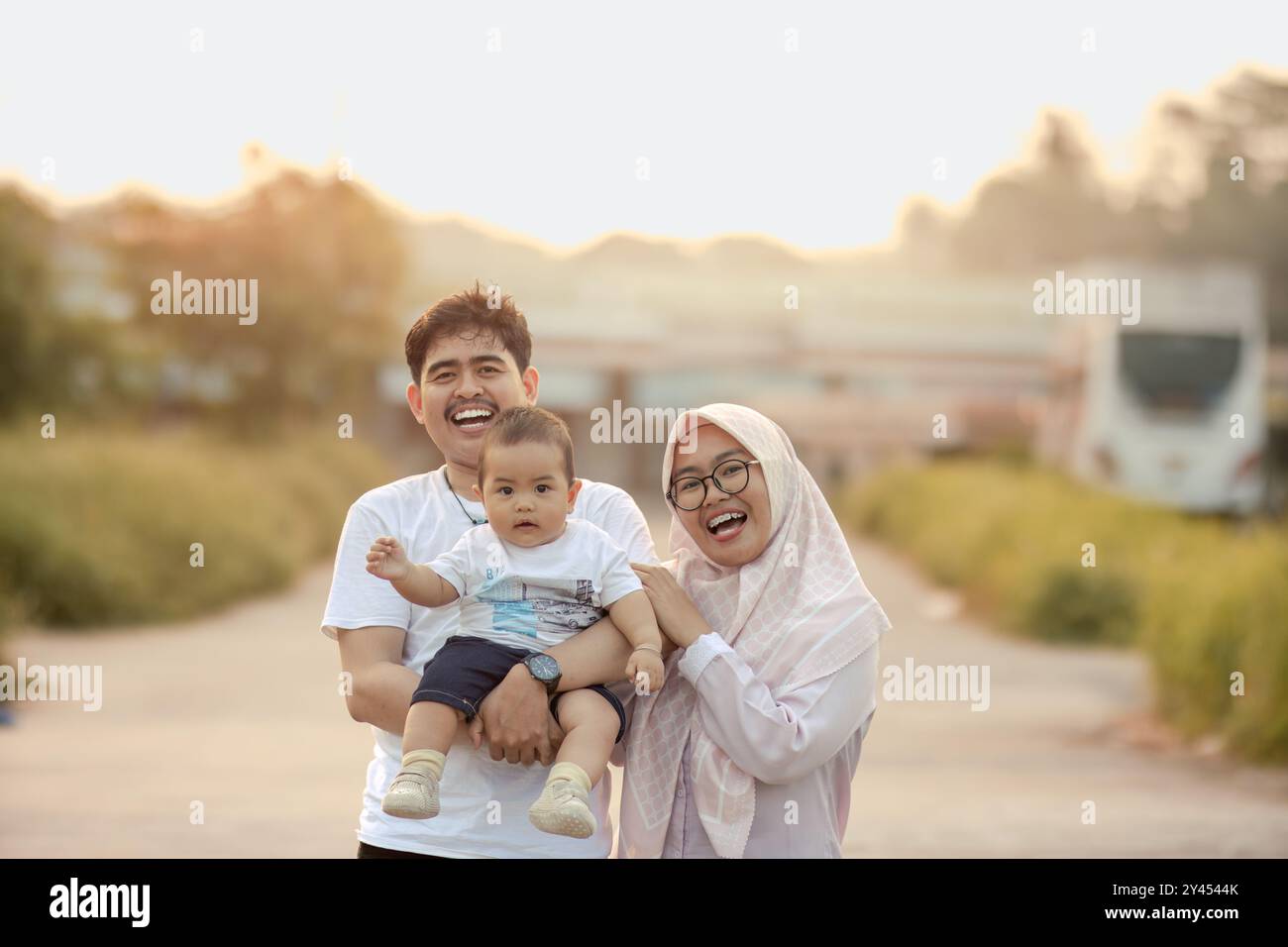 baby boy, mother and father laughing out loud at the camera. a very ...