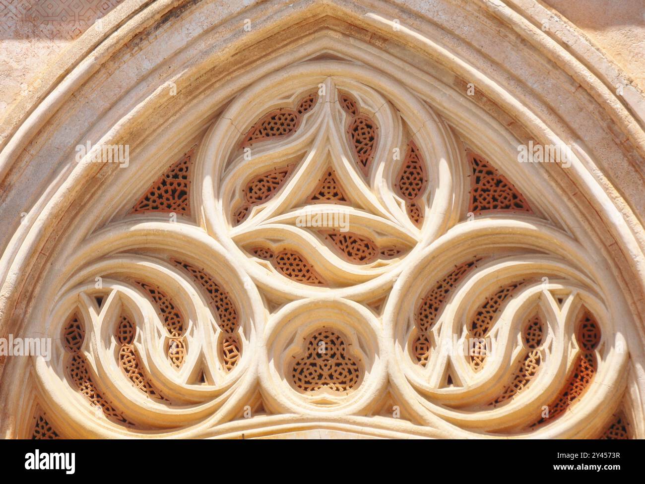 The Royal Monastery of Santa María de Guadalupe with your notable facade for its Mudéjar works Stock Photo