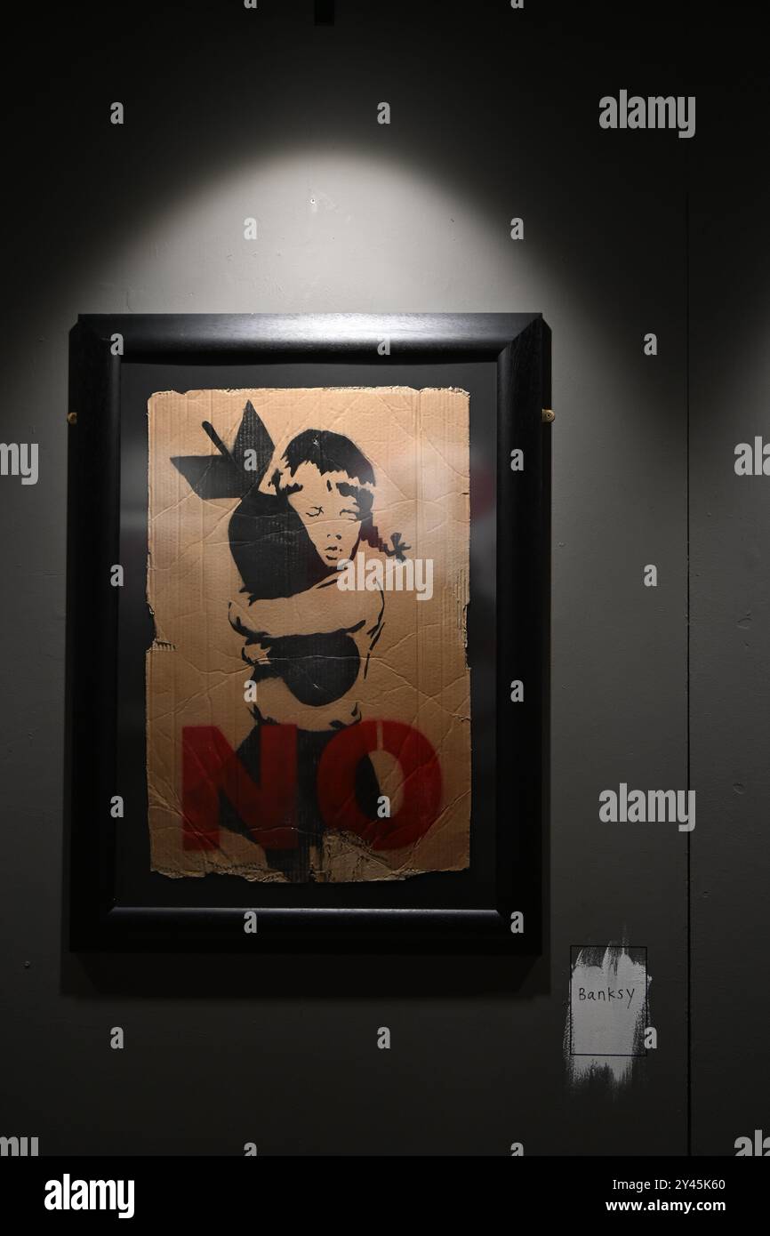 Banksy bomb hugger hi-res stock photography and images - Alamy