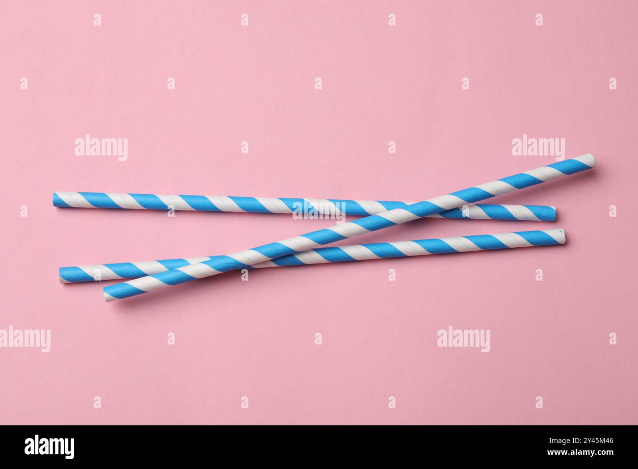 Bamboo drinking straws on pink background, top view Stock Photo