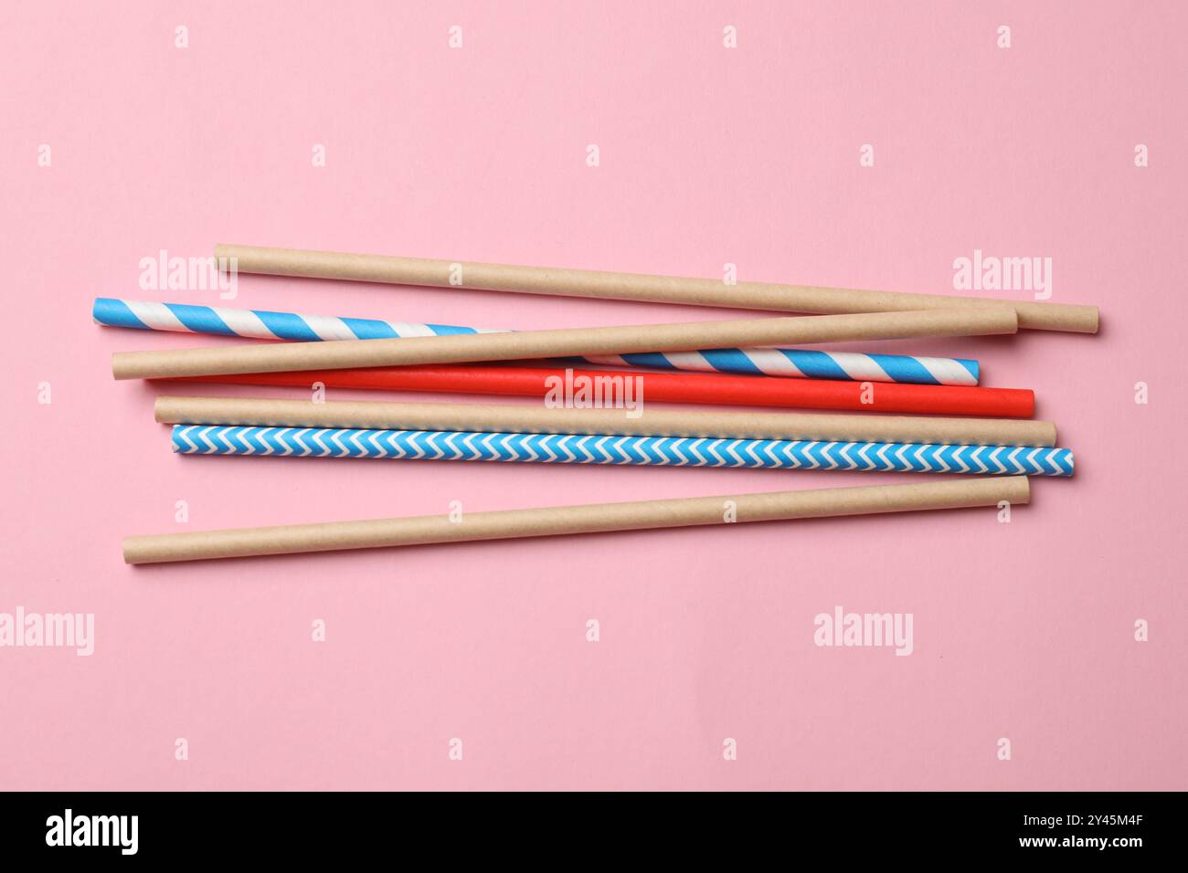 Bamboo drinking straws on pink background, top view Stock Photo