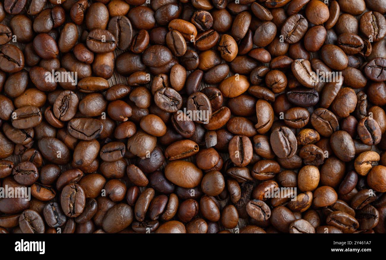 Roasted coffee beans on a flat background Stock Photo - Alamy