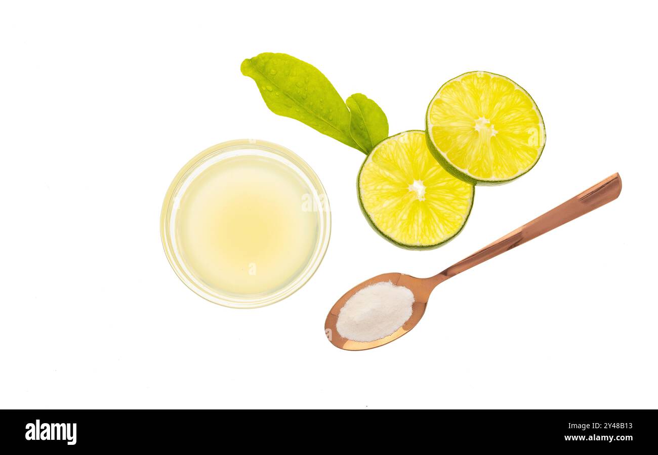 Baking soda with lemon lime juice to speed up metabolism - Citrus latifolia. Stock Photo