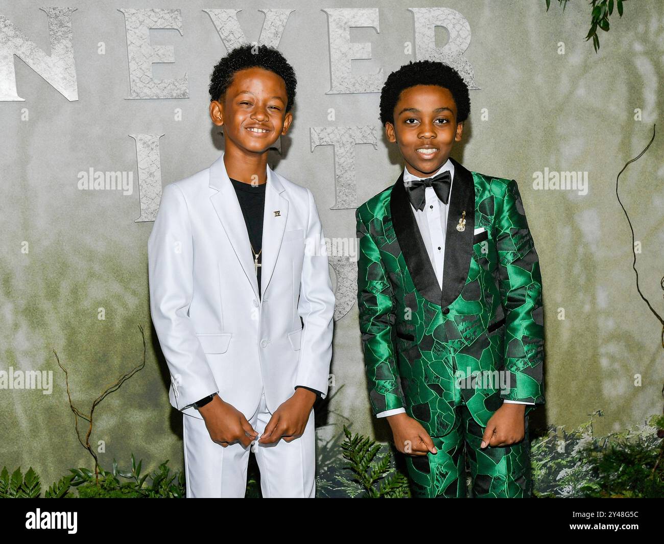 Percy Daggs IV, left, and Anthony B. Jenkins attend the "Never Let Go