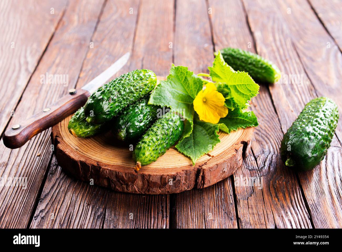 cucumbers on wooden cutting board, fresh organic vegetable food Stock Photo