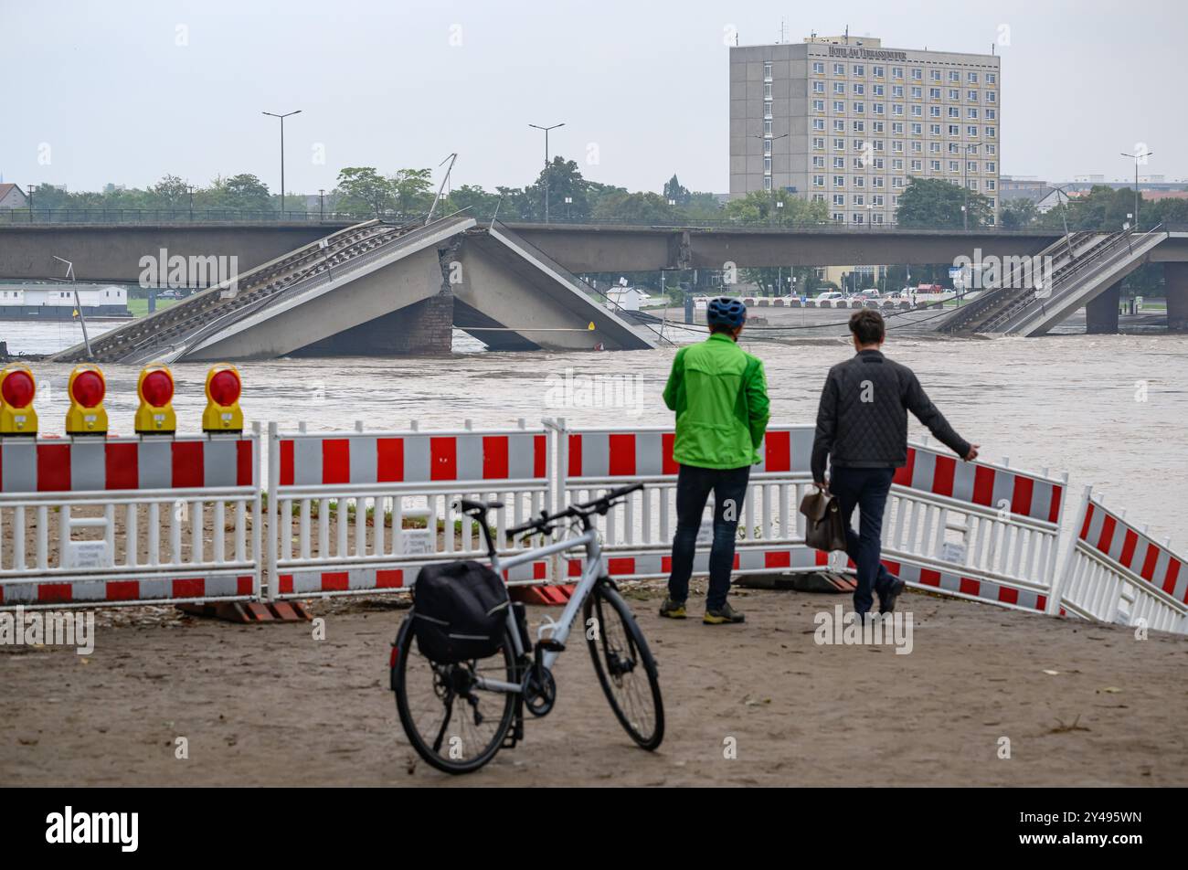 Dresden, Germany. 17th Sep, 2024. Two men stand at a barrier on the ...