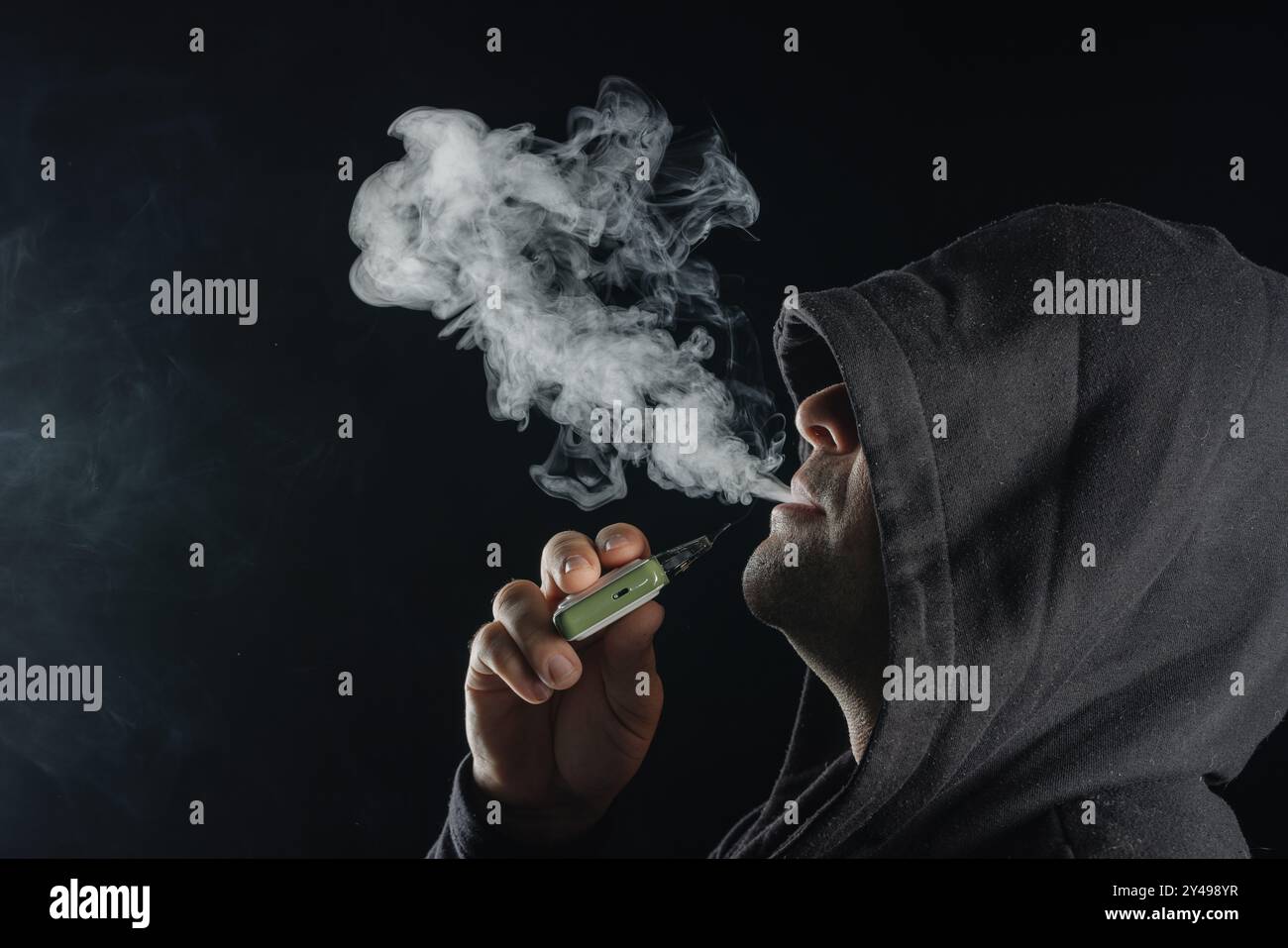Cool guy smoking exhaling vape hi-res stock photography and images