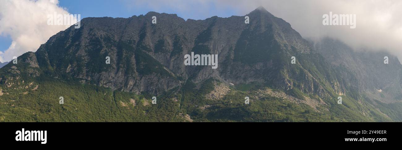 Panoramic Mountain Range Shrouded in Clouds Stock Photo - Alamy