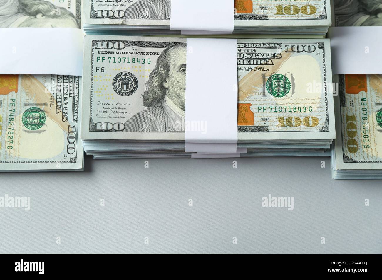 Bundles of dollar banknotes on light grey background, above view Stock ...
