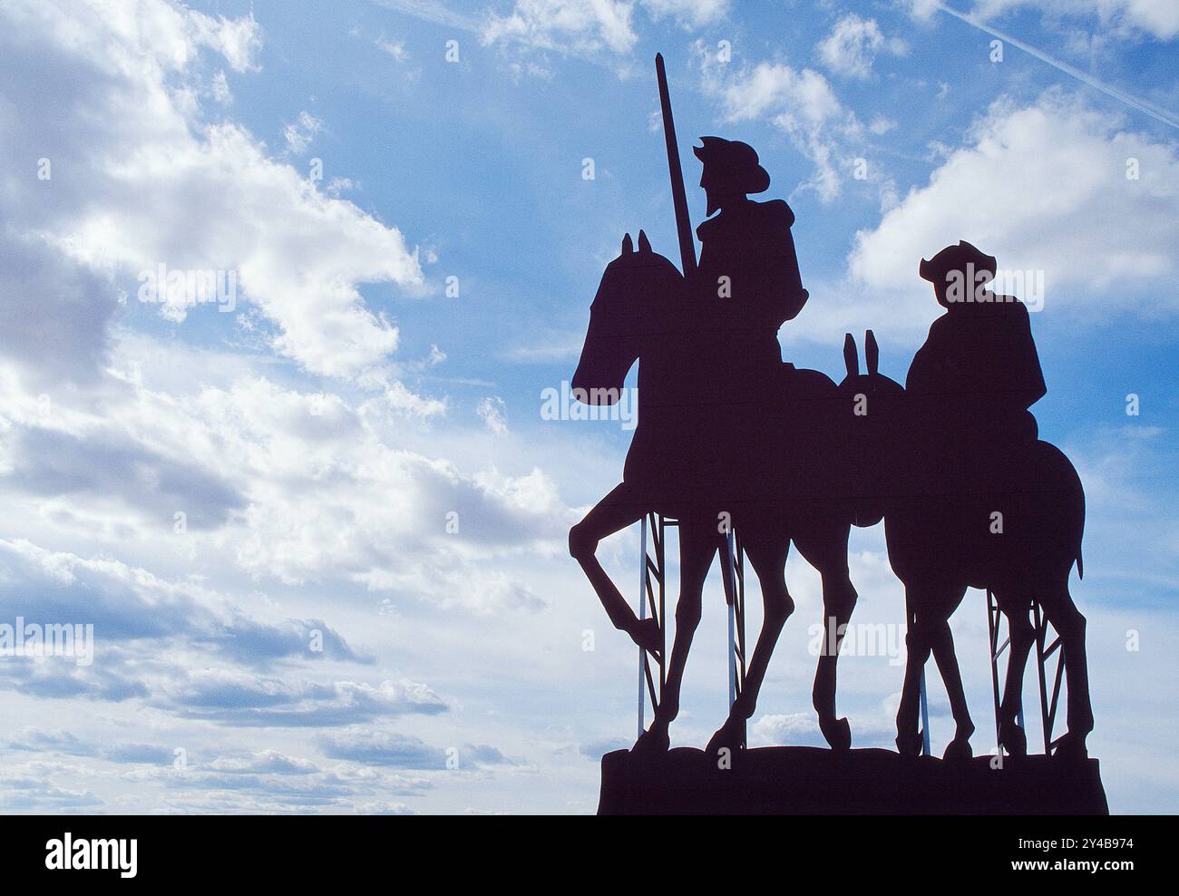 Don Quijote And Sancho Panza Silhouettes Against Blue Sky La Mancha