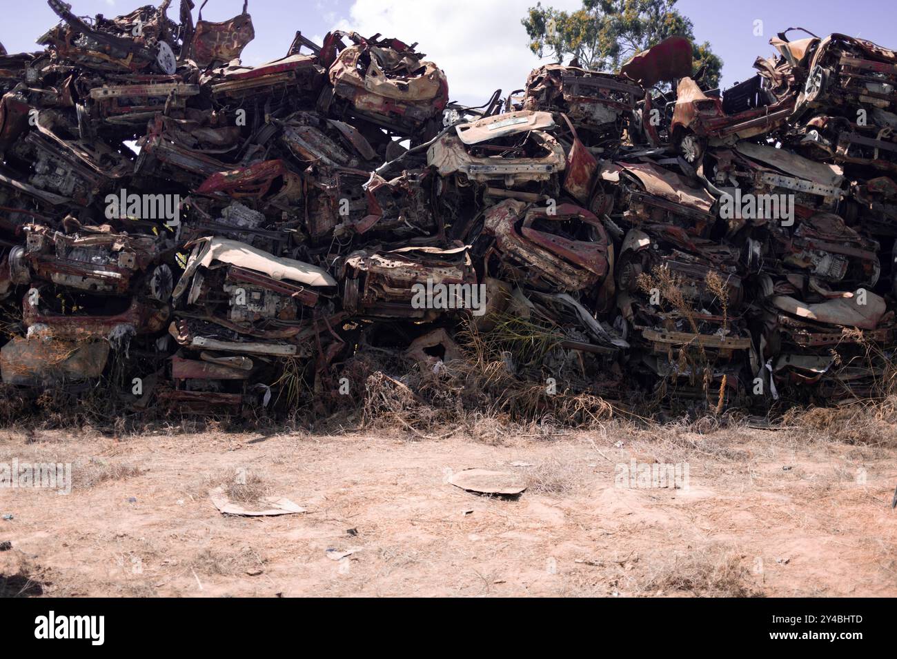 A large pile of wrecked cars damaged during the October 7 Israel-Gaza war, showcasing the devastation caused by the conflict. Stock Photo