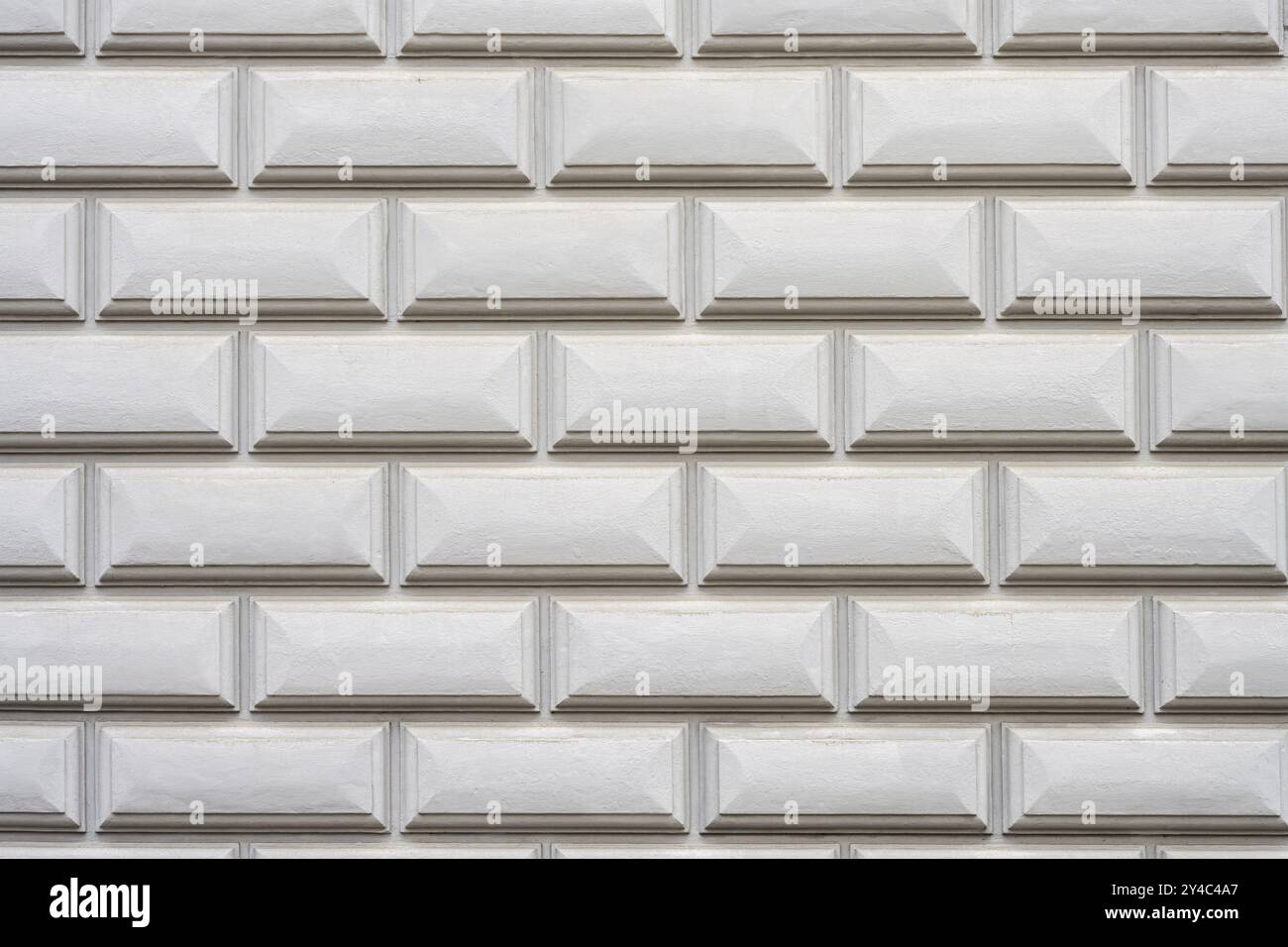 Background consisting of a wall with rectangular grey stone slabs Stock Photo