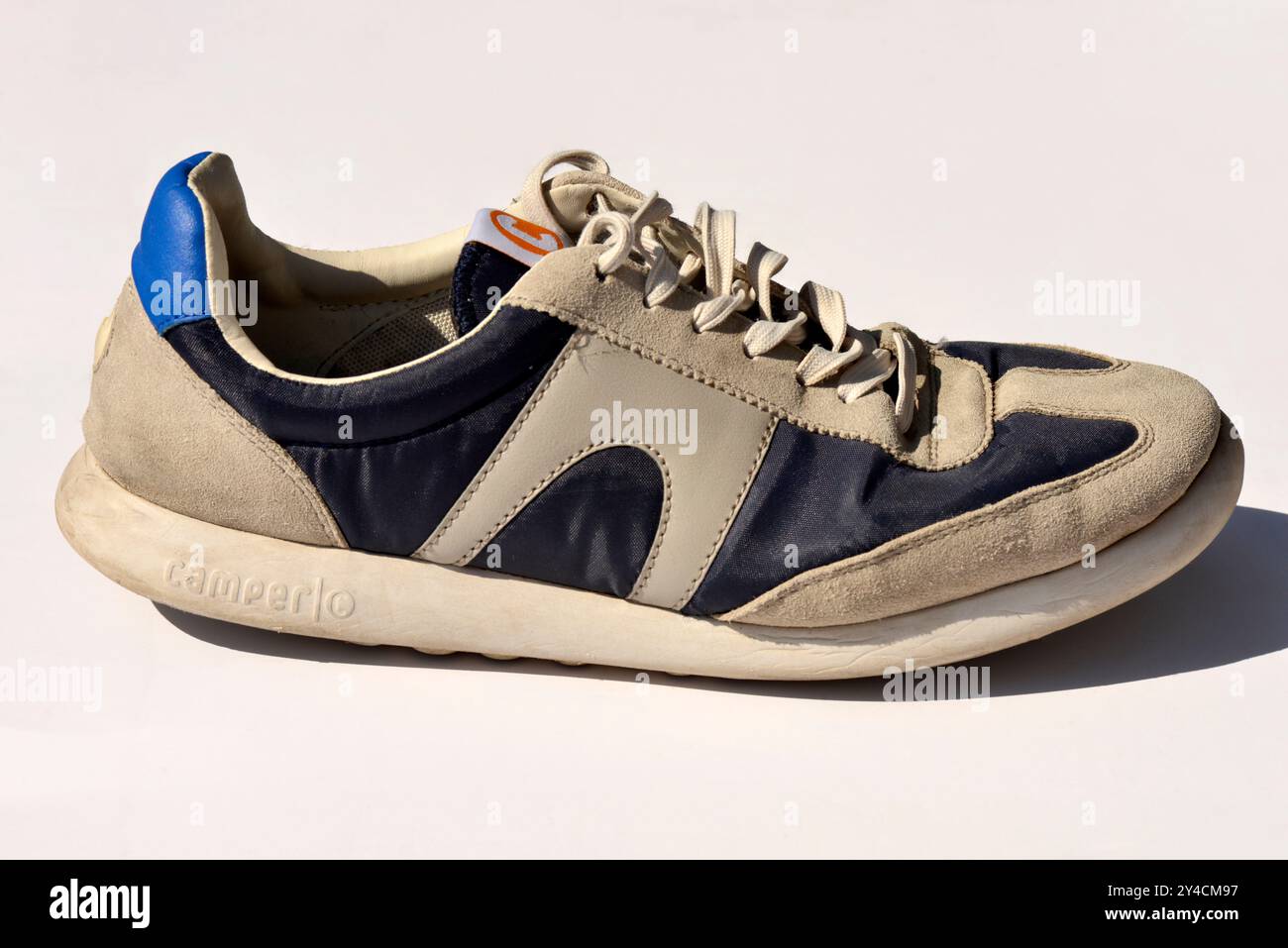 Single old Camper shoe vintage trainers and casual urban shoes on white Stock Photo