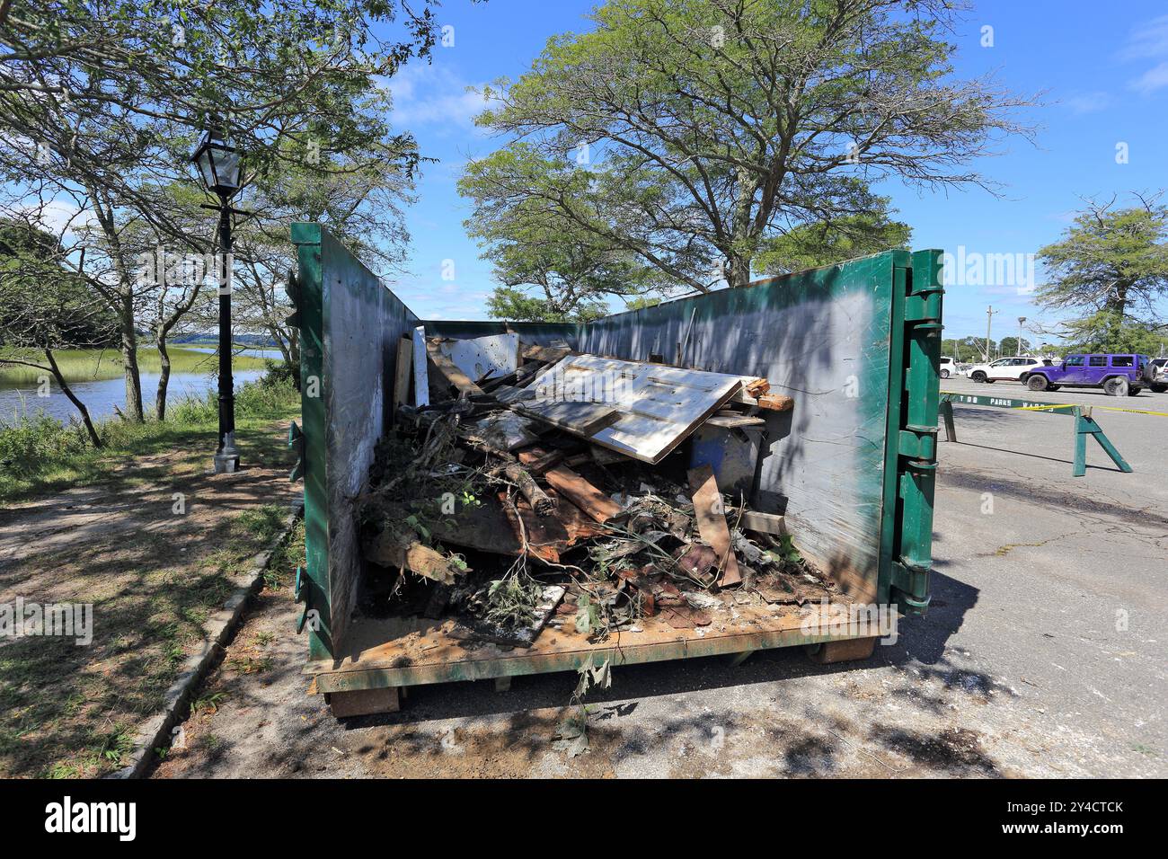 Garbage dumpster with flood damage debris Stony Brook Long Island NY Stock Photo