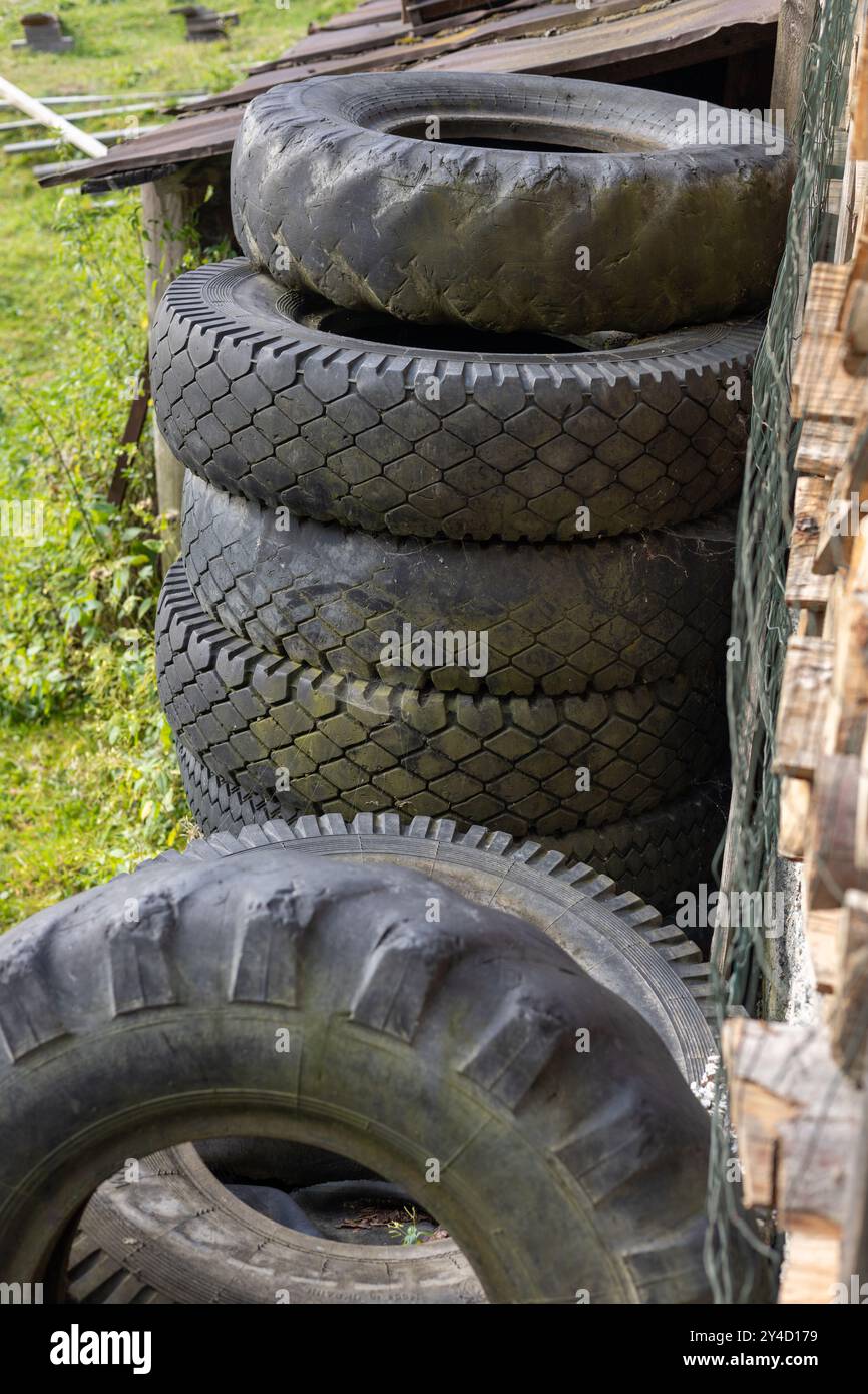 tractor and car balck old tires in a stack Stock Photo