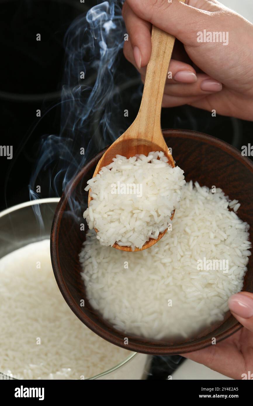 Boiled Rice Photography Female hand taking boiled hi-res stock photography and images - Alamy