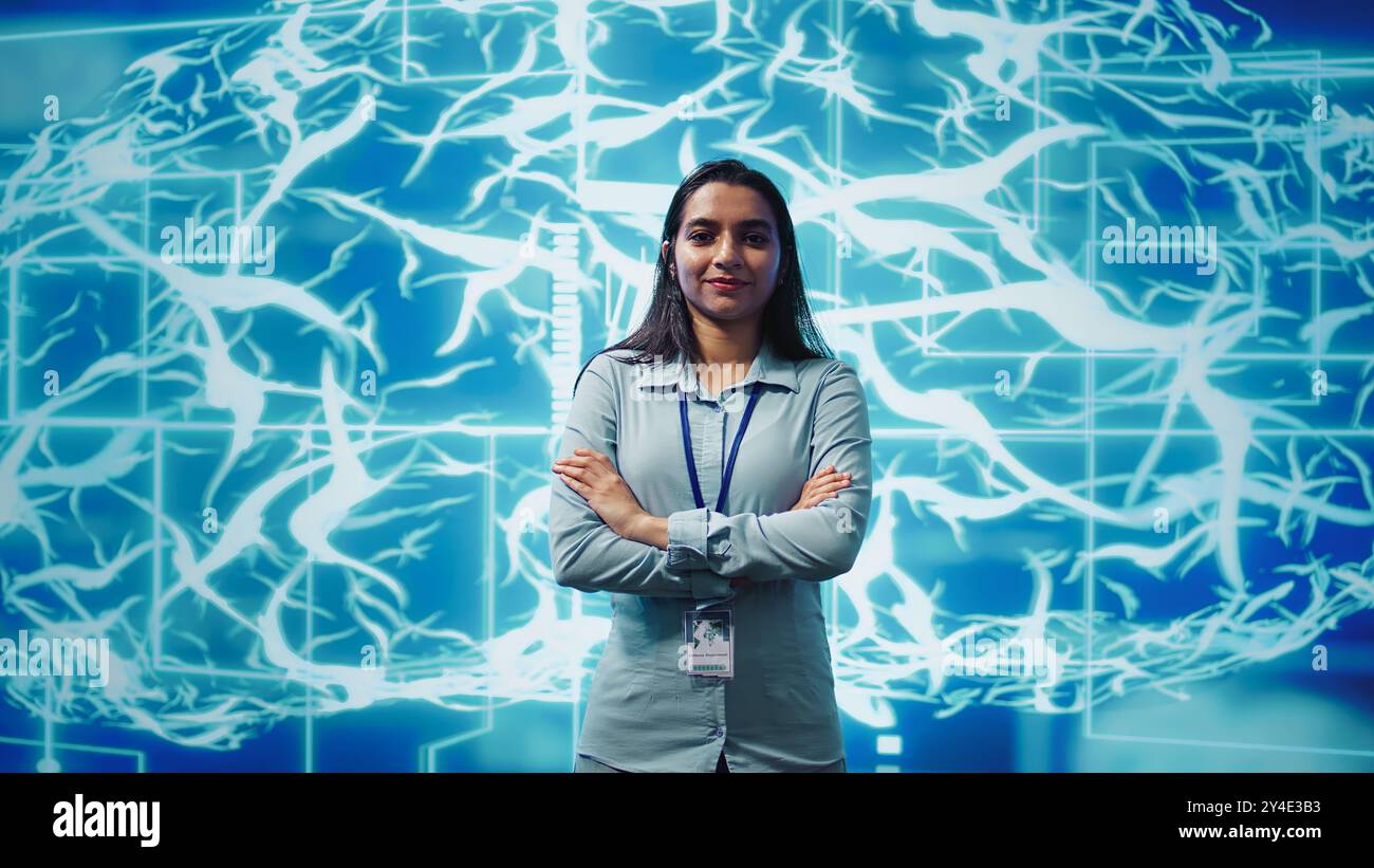Portrait of smiling technician running artificial intelligence programming scripts. Joyful admin working in IT department tasked with AI applications development, camera B Stock Photo