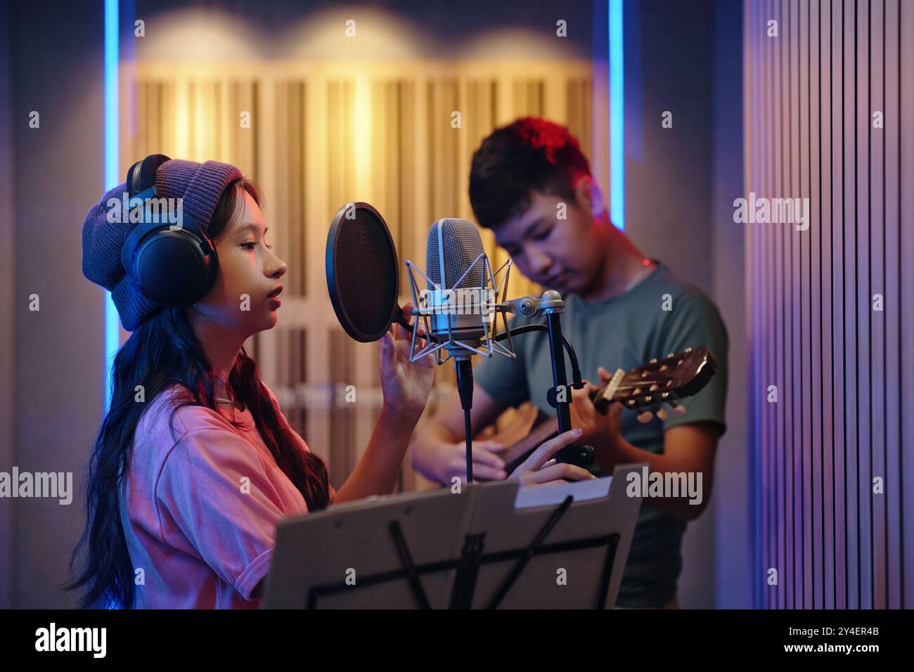 Recording Vocals in Music Studio with Acoustic Guitar Player Stock ...