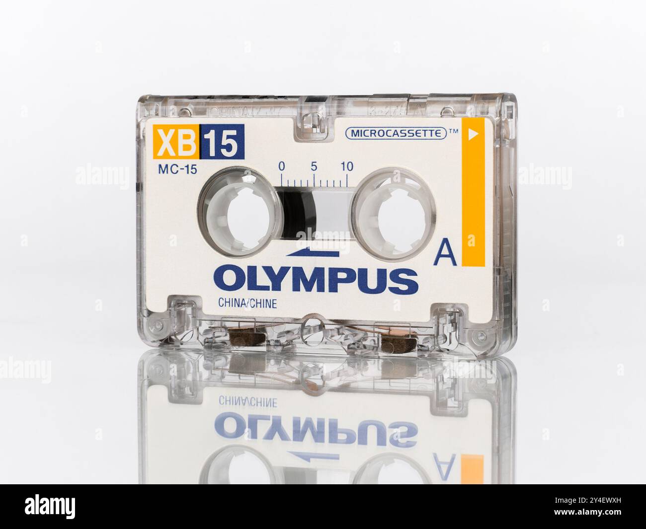 Close-up micro audio cassette for voice recorders Olympus XB15 MC-15 Microcassette standing isolated on a white background Stock Photo