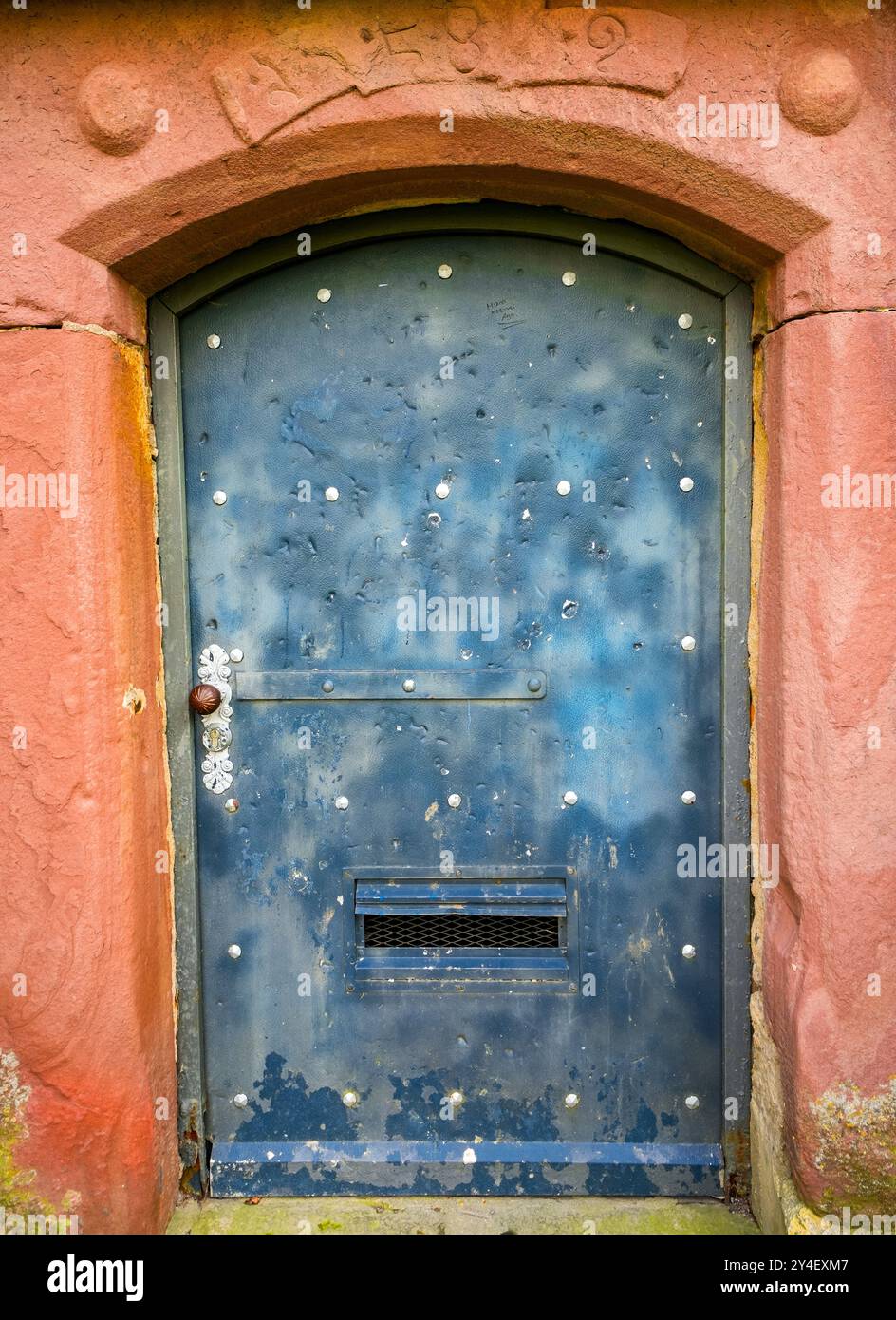 Old weathered metal door. Stock Photo