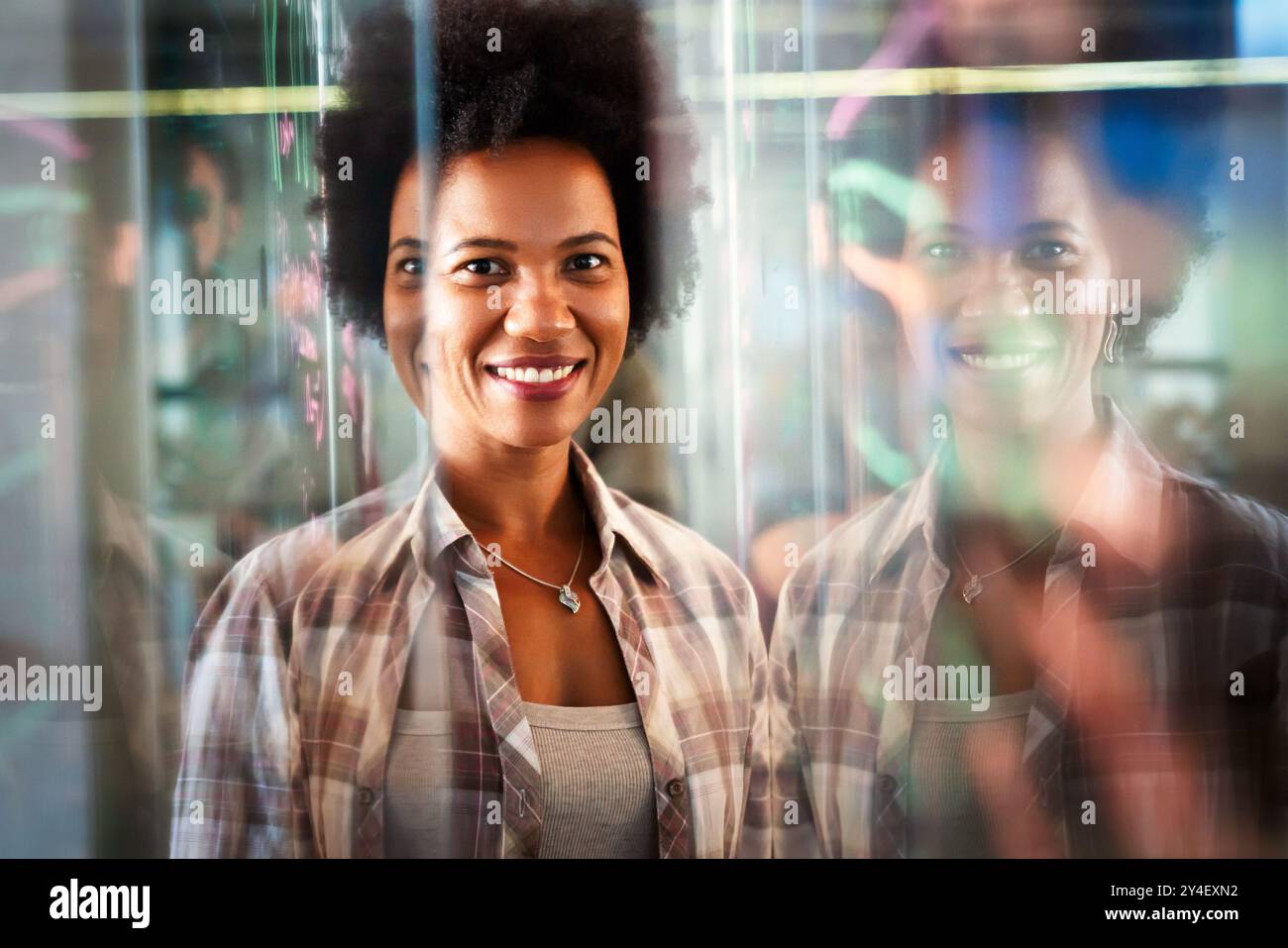 Portrait of african american female IT developer, programmer, designer working with programming code Stock Photo