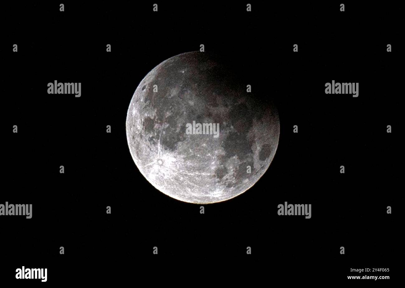 Swansea, UK. 18th Sep, 2024. A rare partial lunar eclipse of the ...
