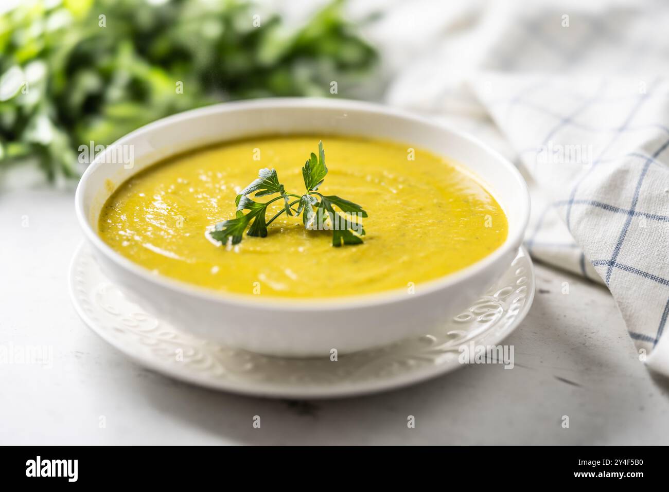 Healthy creamy vegetable soup in a white bowl Stock Photo - Alamy