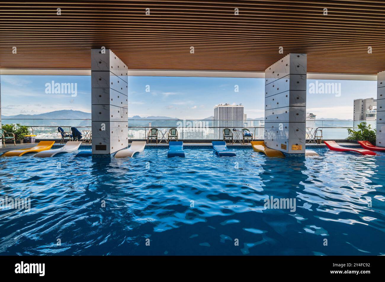 interior on the roof of a luxury skyscraper hotel with a swimming pool ...