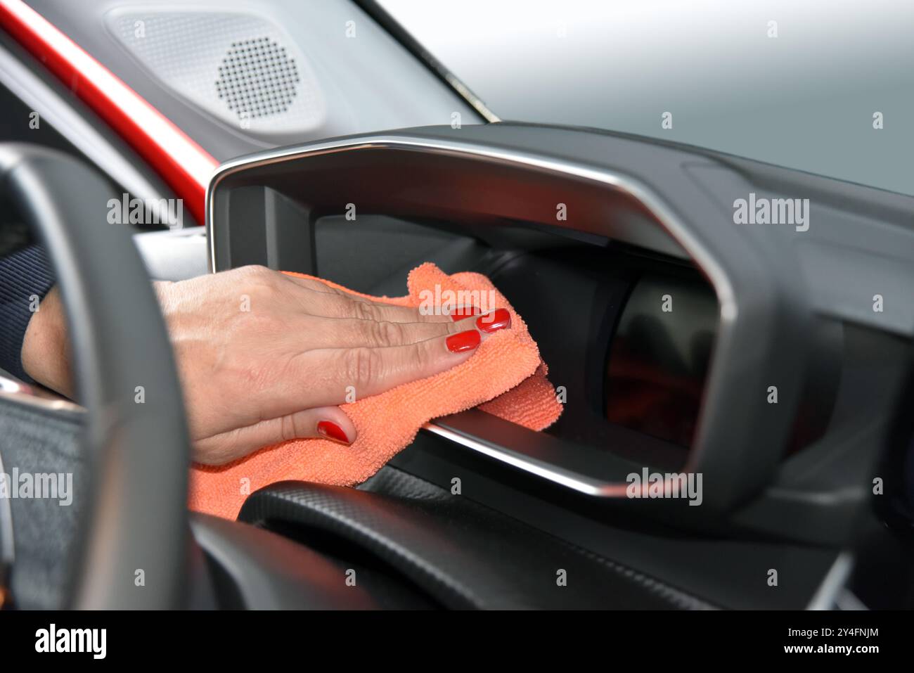 Cleaning the car console with a microfiber cloth Stock Photo - Alamy