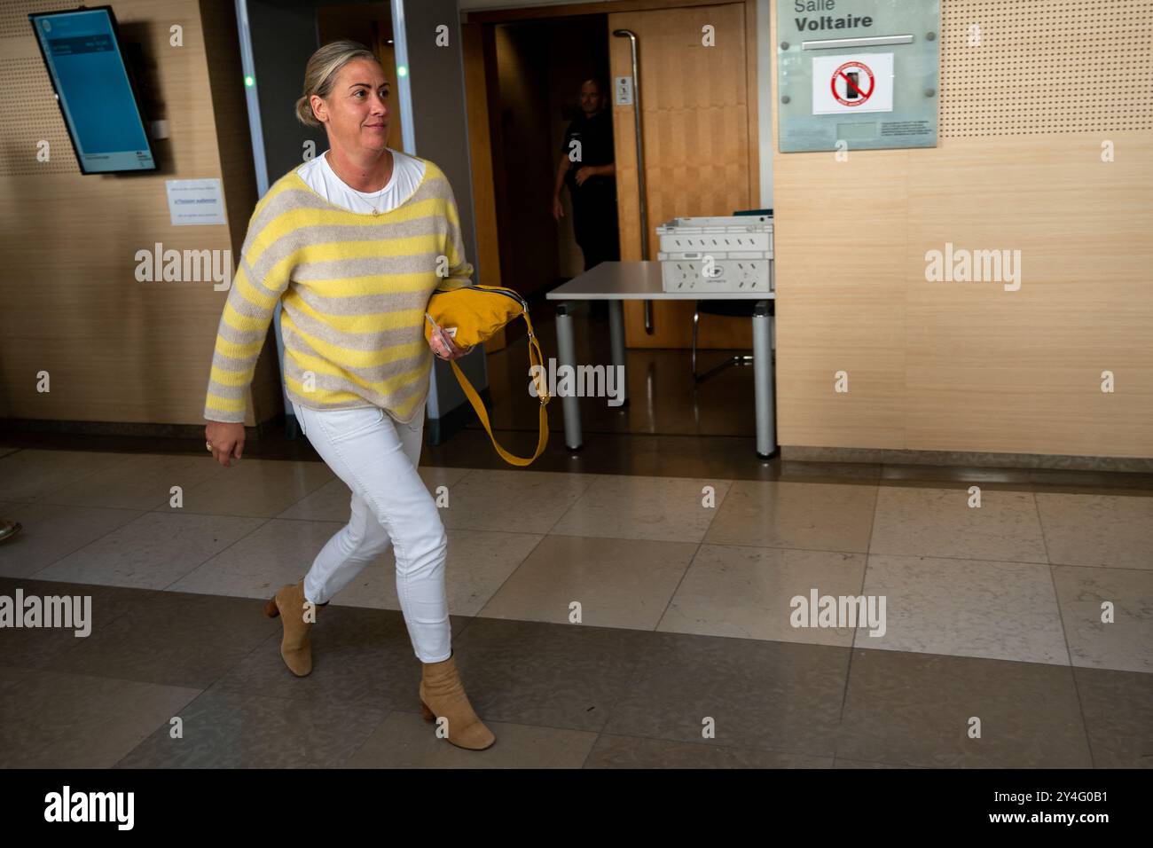 Gisele Pelicot's daughter Caroline Darian exits the courtroom on