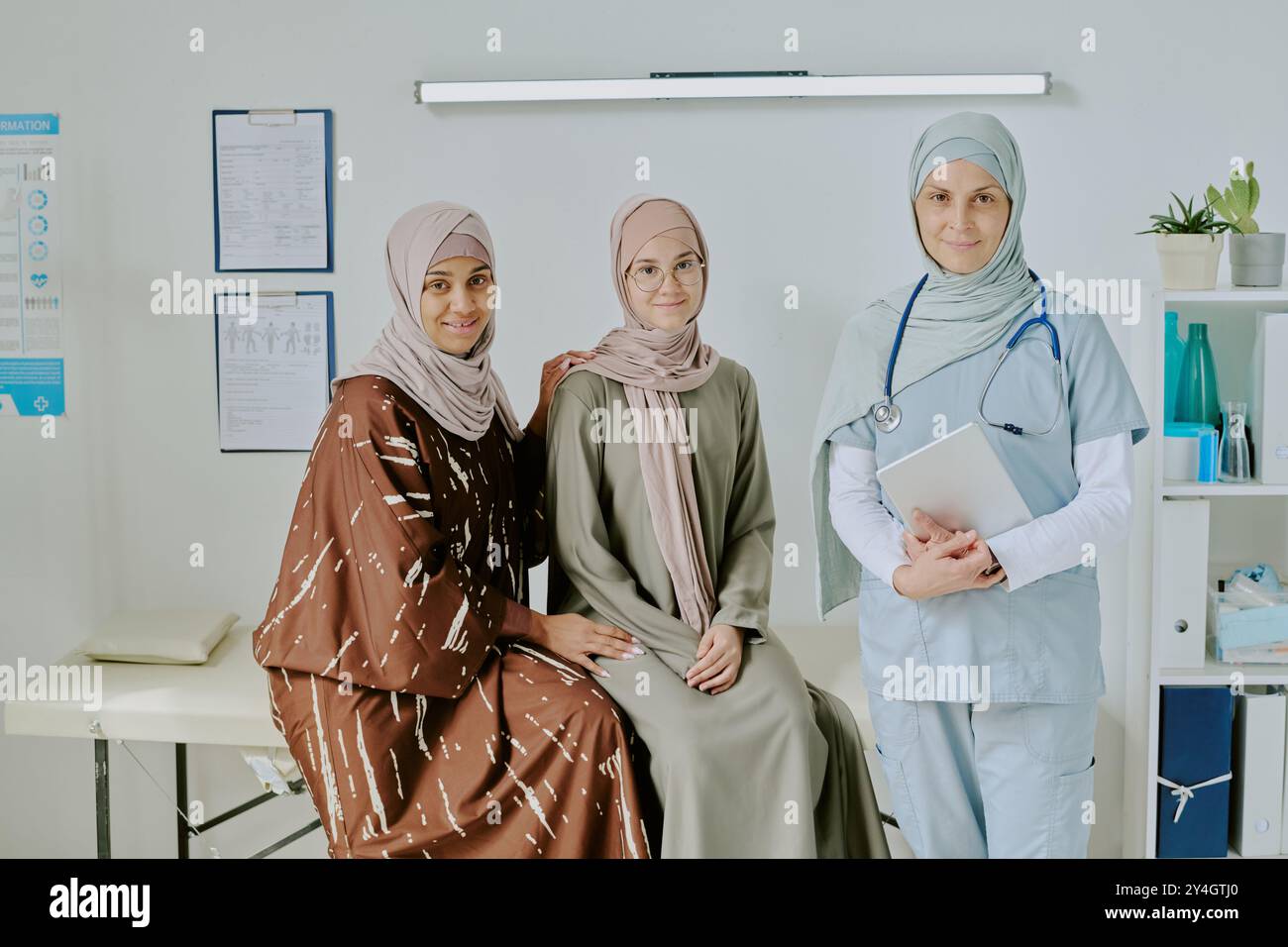 Smiling Healthcare Professionals in Medical Office Environment Stock Photo