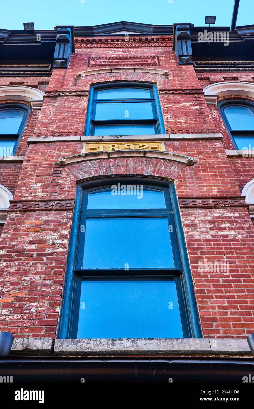 Historic Brick Facade with Arched Windows Upward View Stock Photo - Alamy