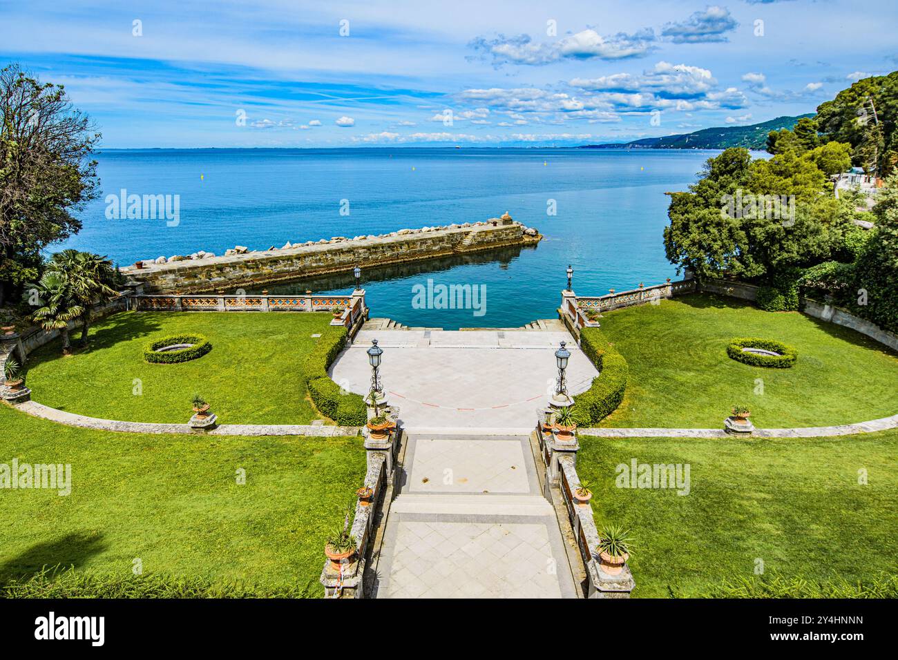 TRIESTE, ITALY – MAY 29, 2024: Miramare Castle. This historic castle, set on a cliff overlooking the Adriatic Sea, features elegant architecture and l Stock Photo