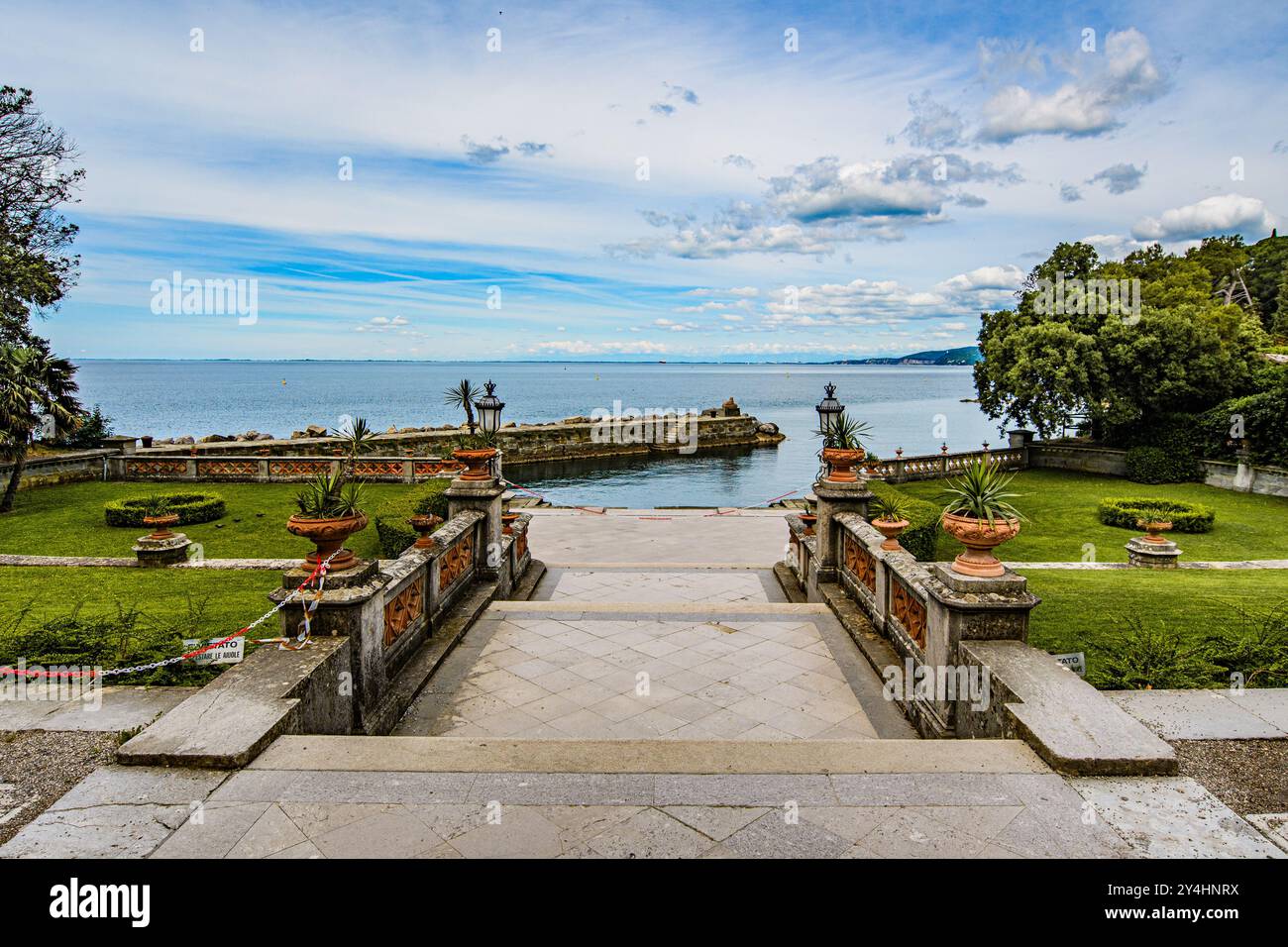 TRIESTE, ITALY – MAY 29, 2024: Miramare Castle. This historic castle, set on a cliff overlooking the Adriatic Sea, features elegant architecture and l Stock Photo