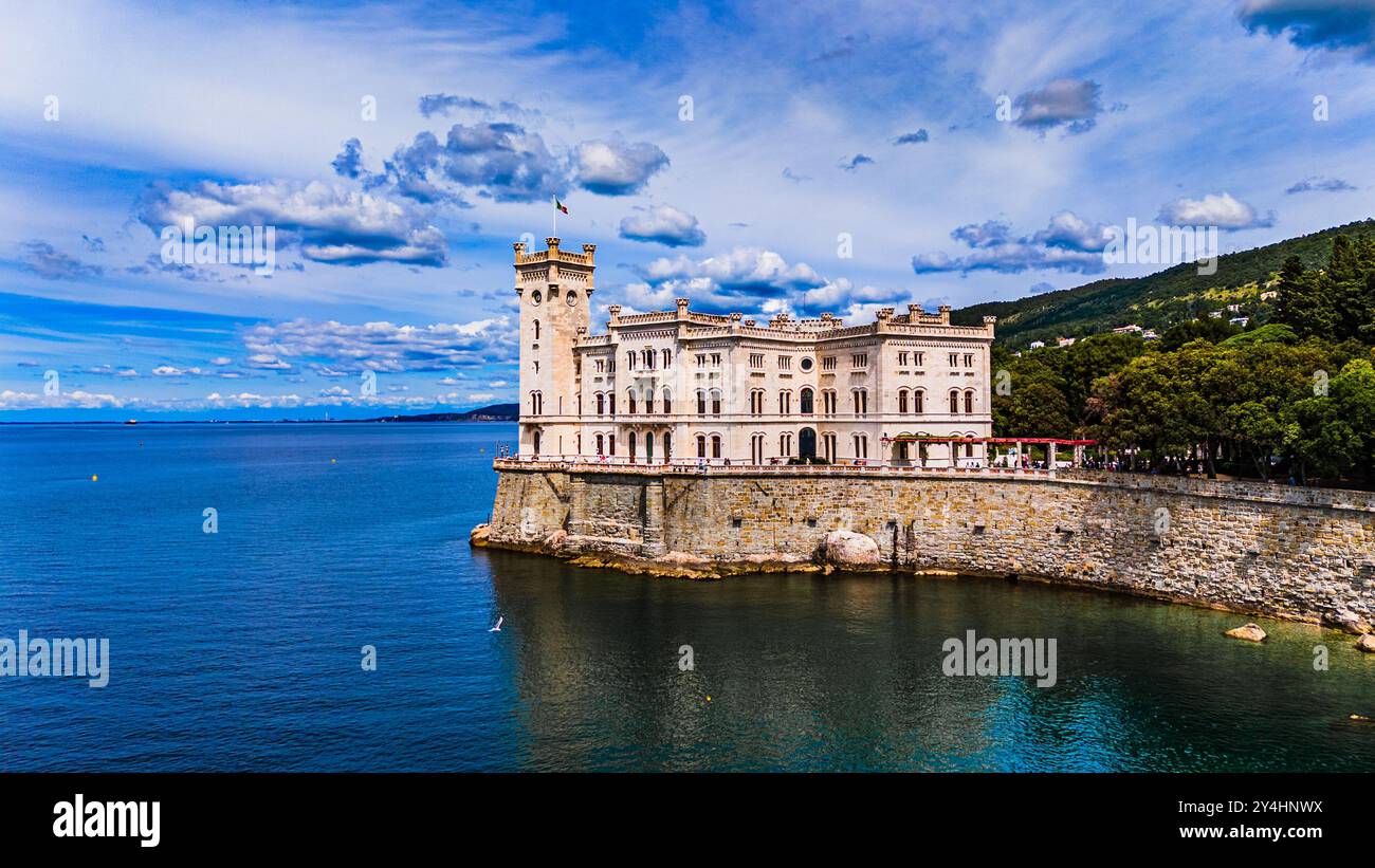 TRIESTE, ITALY – MAY 29, 2024: Miramare Castle. This historic castle, set on a cliff overlooking the Adriatic Sea, features elegant architecture and l Stock Photo