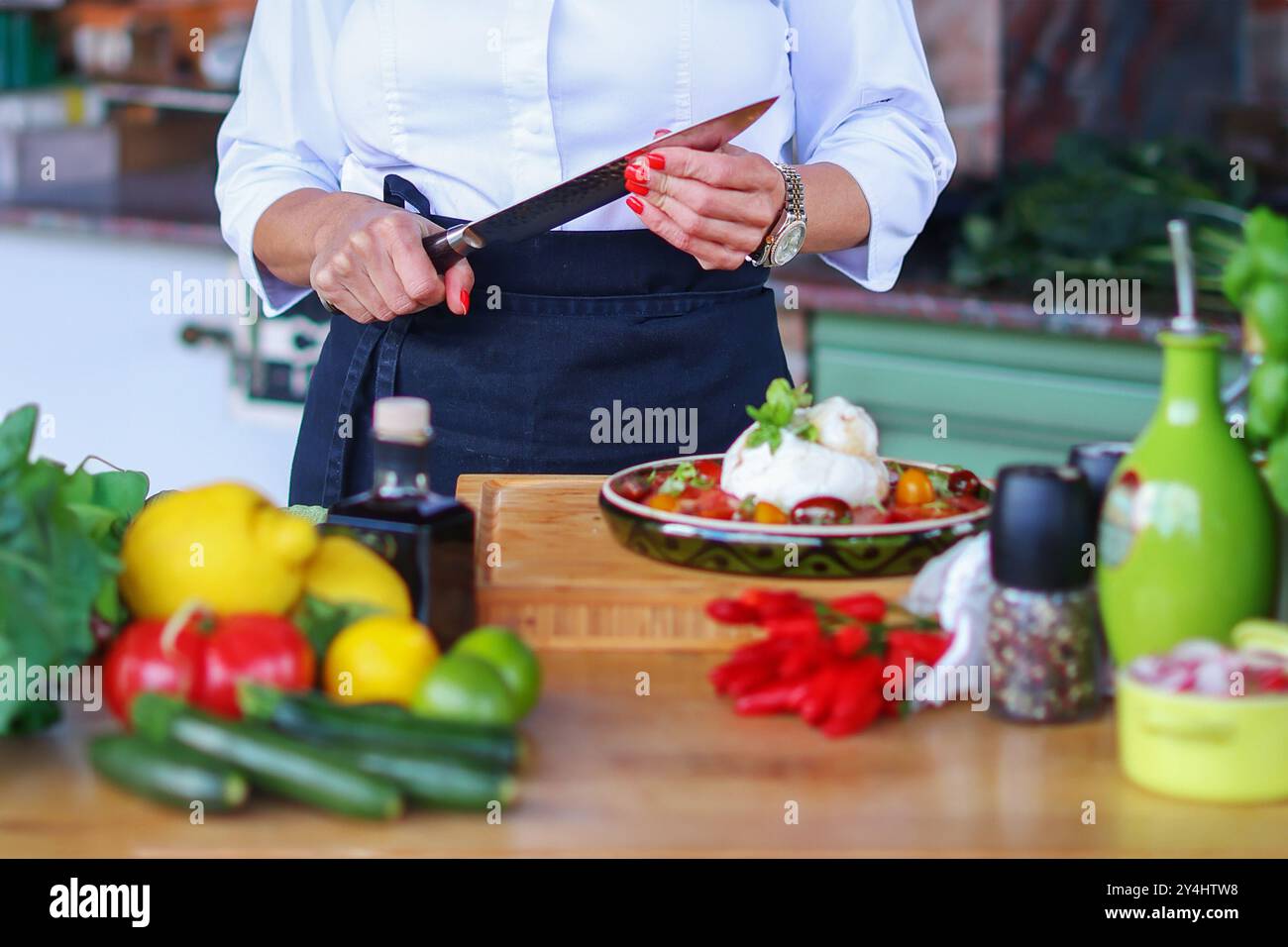 Chefs hands cutting red peppers hi-res stock photography and images - Alamy