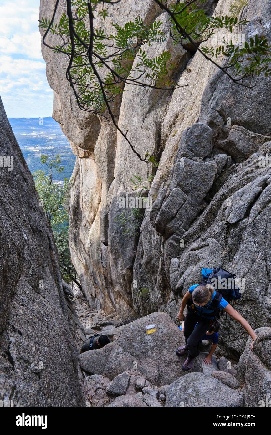 Hikers climbing among rocks hi-res stock photography and images - Alamy