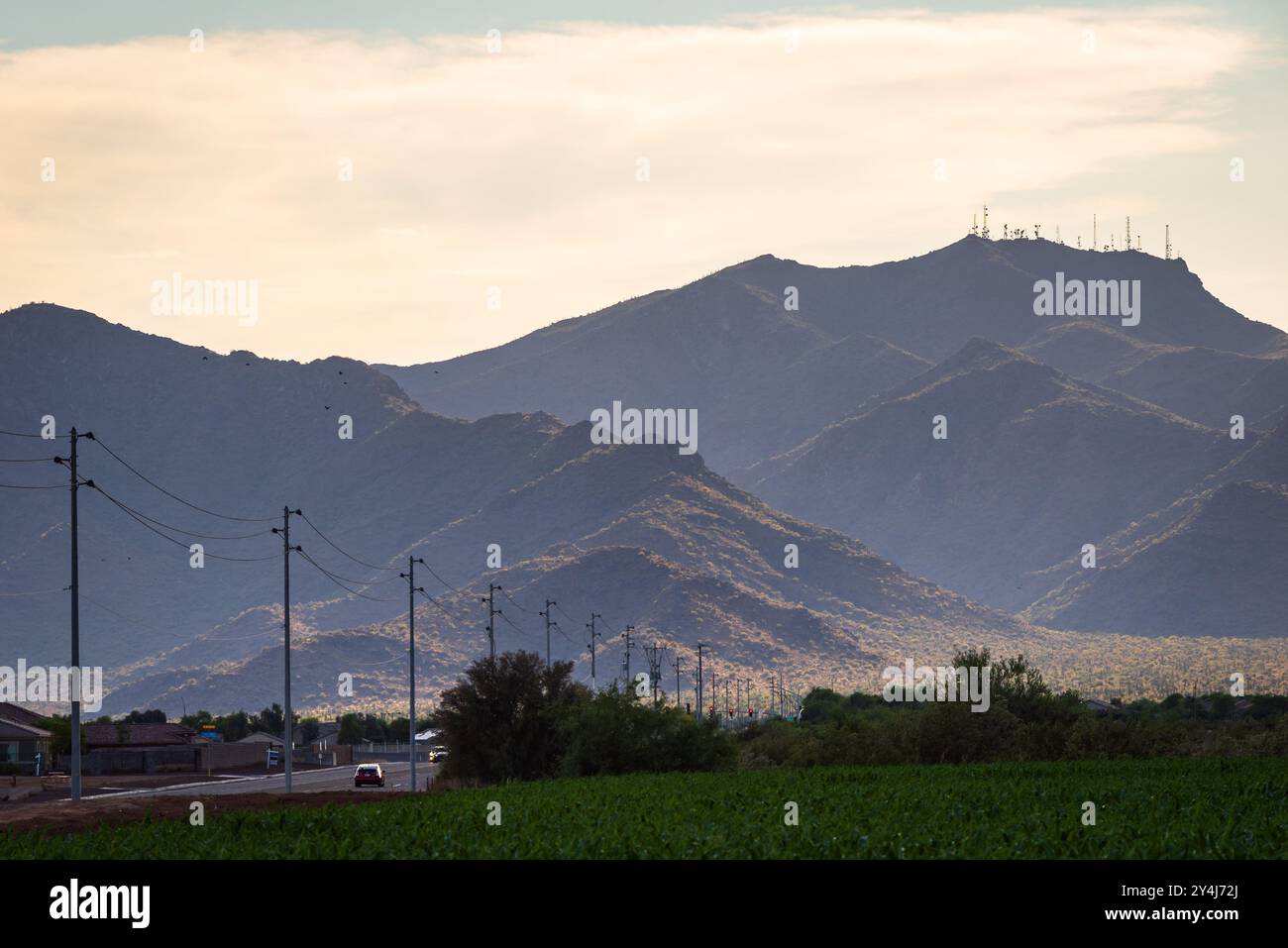 White Tank Mountain Road with view of White Tank Mountains in the background in Waddell, Arizona. Stock Photo