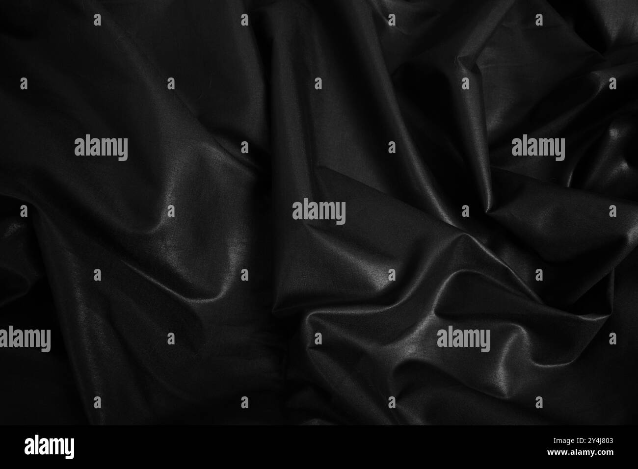 Blac silk textile background. Satin fabric texture, Luxury wavy backdrop. Stock Photo