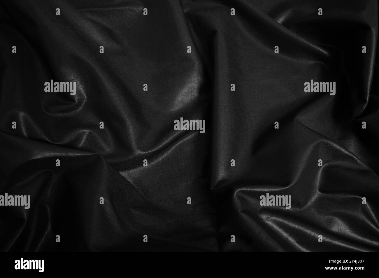 Blac silk textile background. Satin fabric texture, Luxury wavy backdrop. Stock Photo