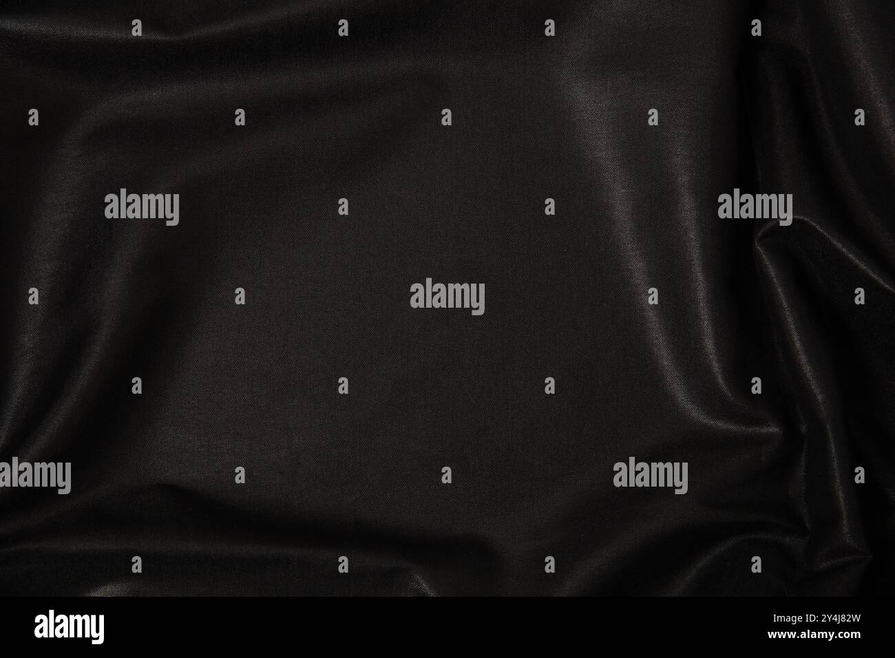 Blac silk textile background. Satin fabric texture, Luxury wavy backdrop. Stock Photo