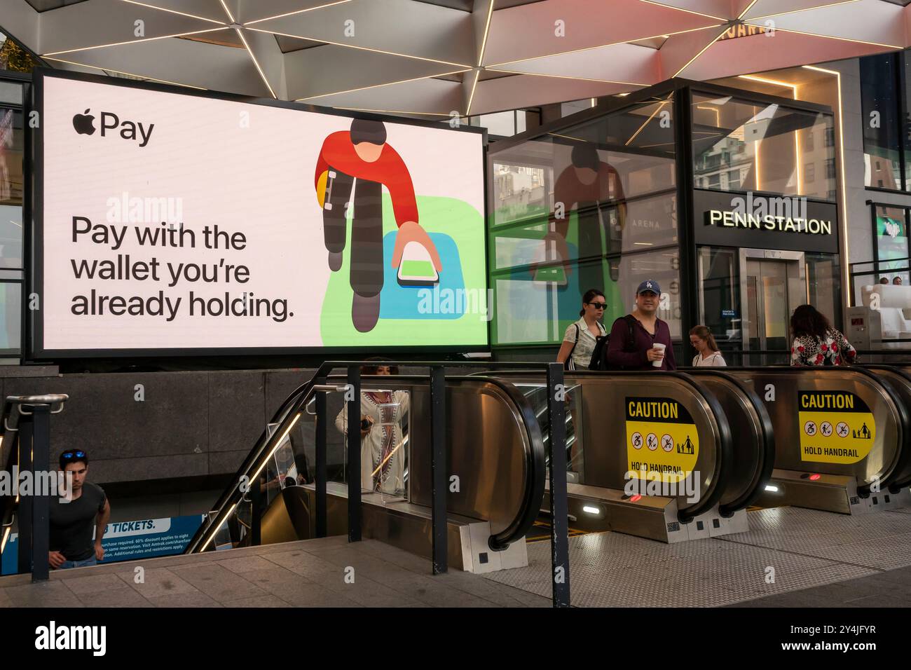Advertising for shopping with Apple Pay at Pennsylvania Station in New York on Sunday, September 15, 2024.  (© Richard B. Levine) Stock Photo