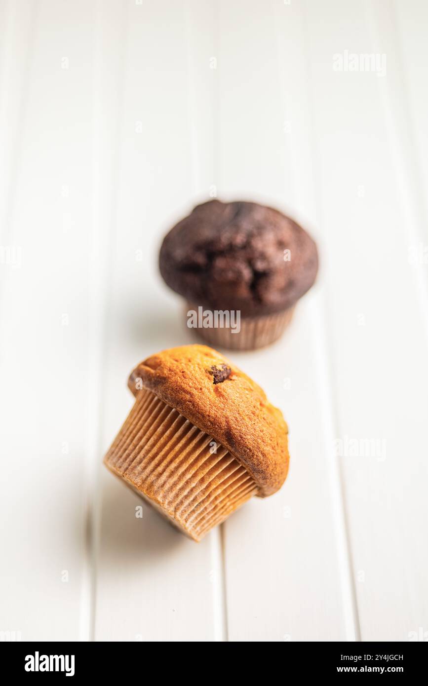 Sweet muffin cakes on a white table. Stock Photo