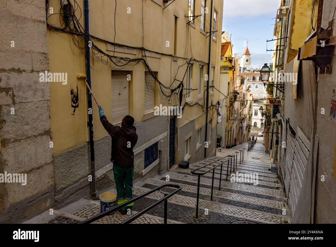 Man paints over graffiti hi-res stock photography and images - Alamy